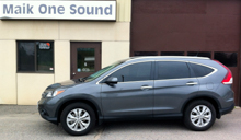 Grey 2013 Honda CR-V with dark privacy window tint